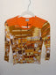 y2k bodycon long sleeve in orange pattern colorful 90s graphic long sleeve shirt retro cafe scene printed tee hanging on hanger showing tag