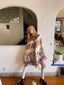 Model wearing 70s Sabra Deck of Hearts poncho with hood